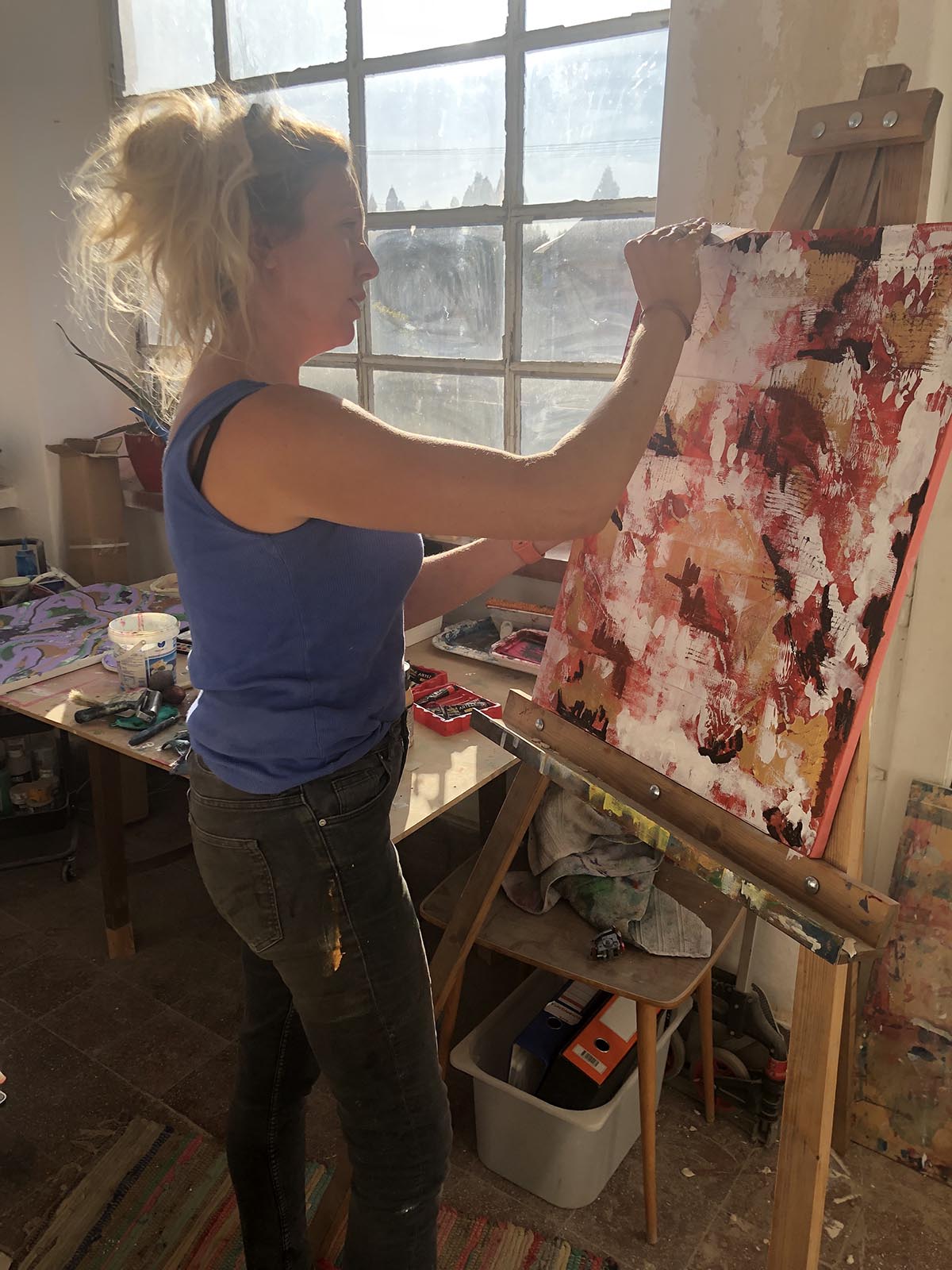 Natalie Forrester painting in her studio